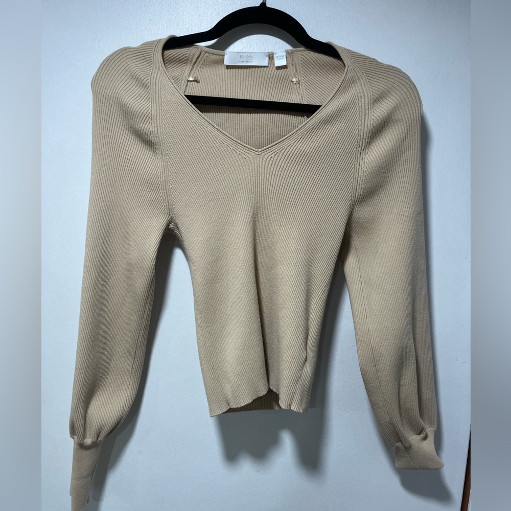 Hugo boss sweater in tan/beige.  Sweater was sold to me as a size medium
